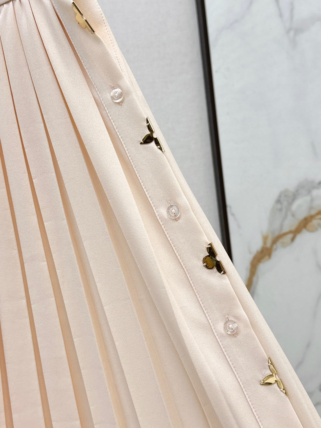 Loui* golden monogram flower accent skirt