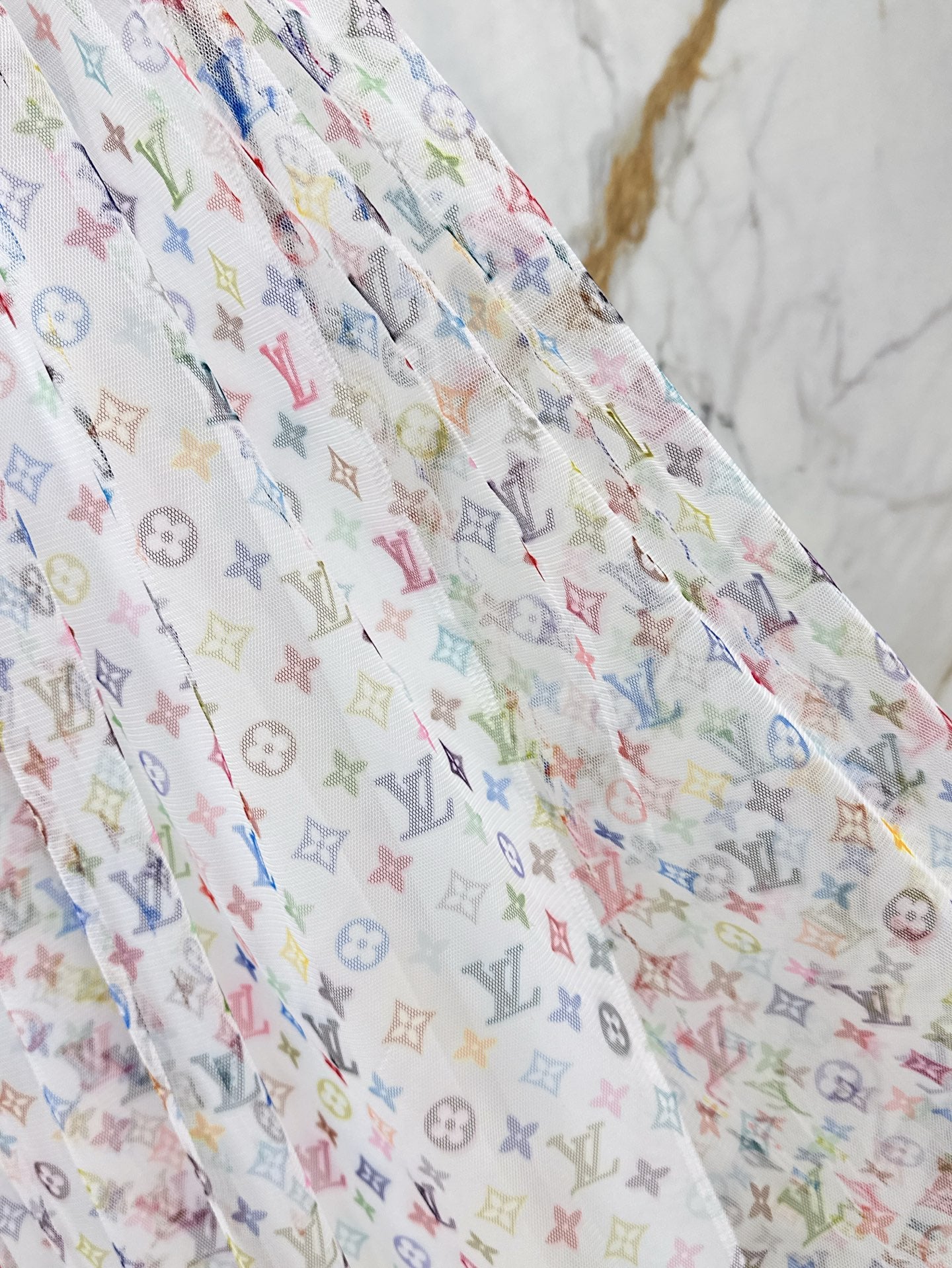 Loui* 25ss monogram print gauze midi skirt