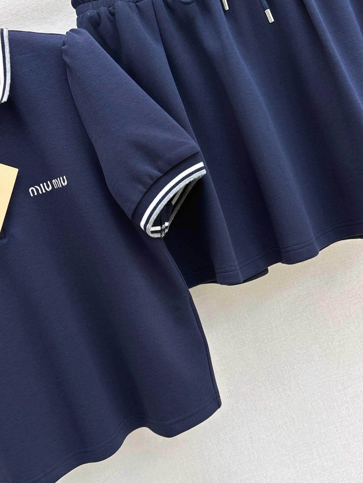 M*u 25ss Polo collar top + mini skirt set