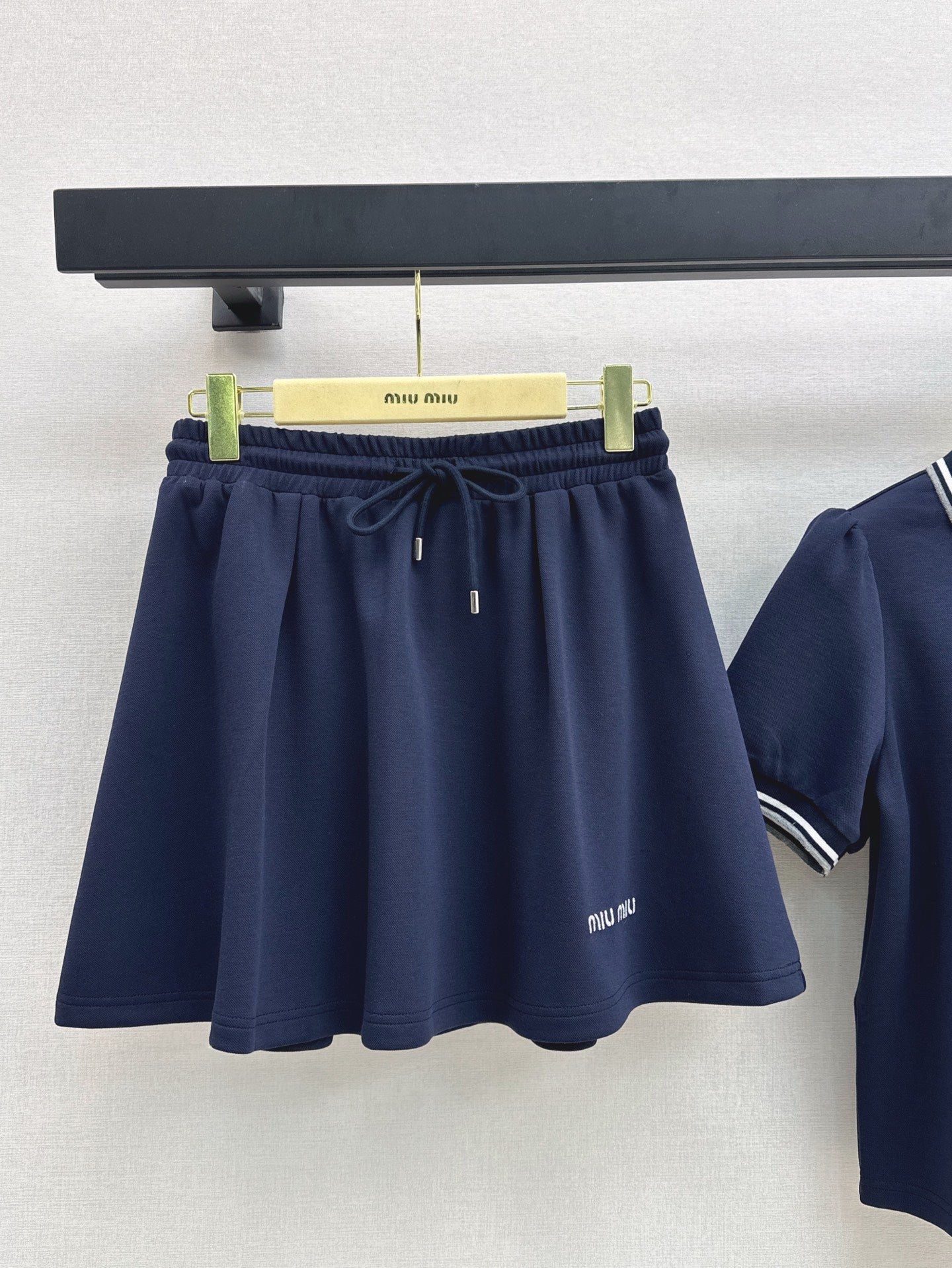 M*u 25ss Polo collar top + mini skirt set