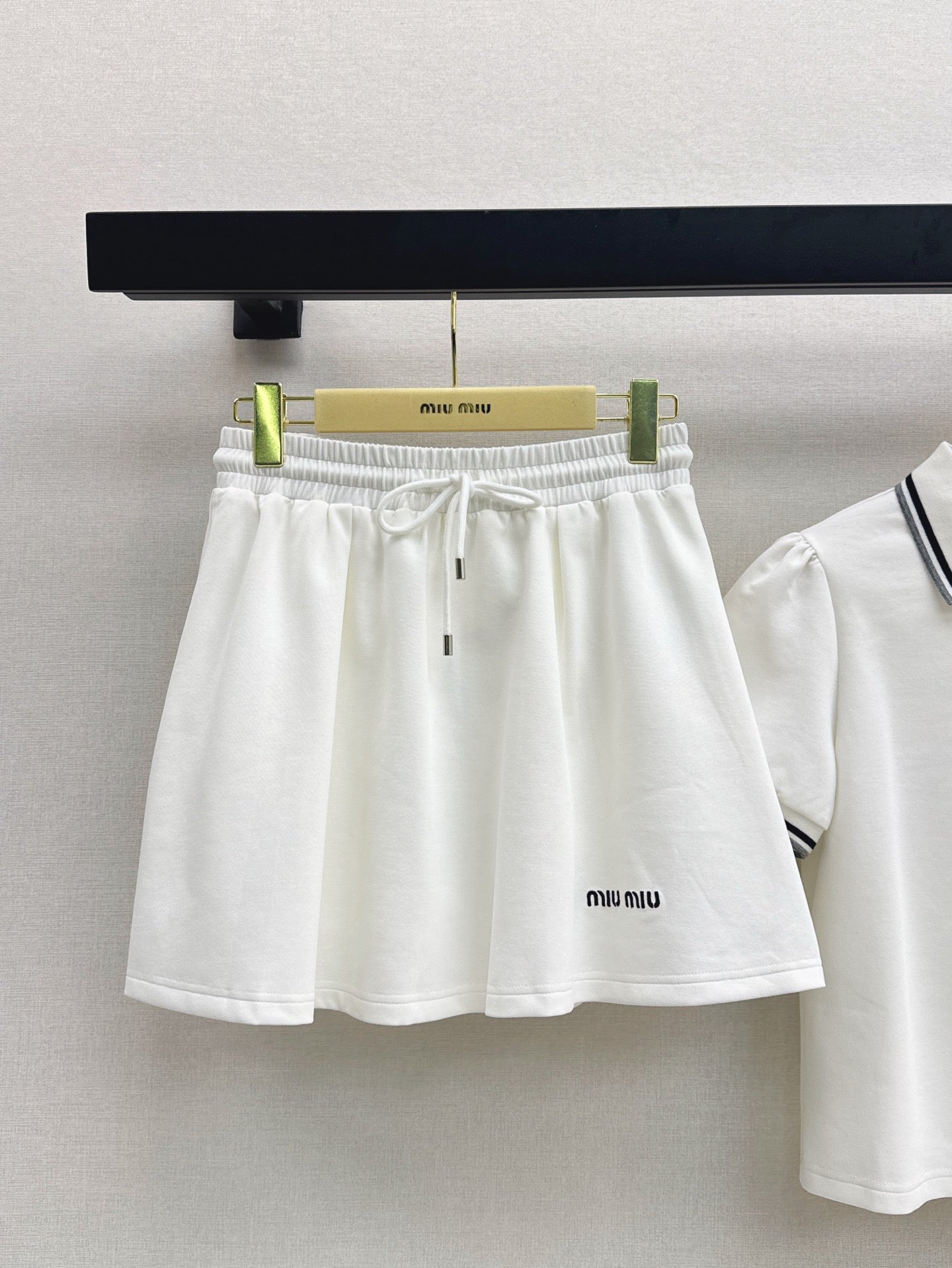 M*u 25ss Polo collar top + mini skirt set