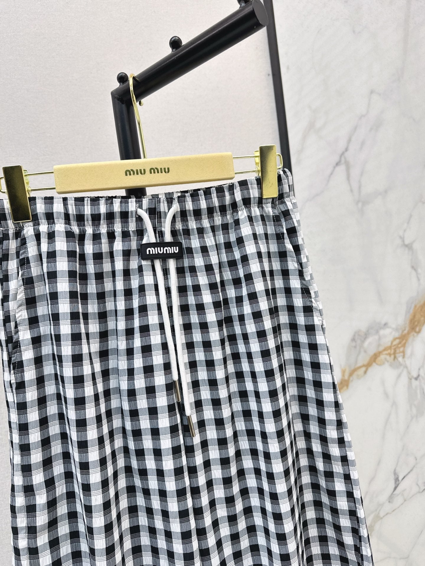 M*u 25ss check drawstring pants