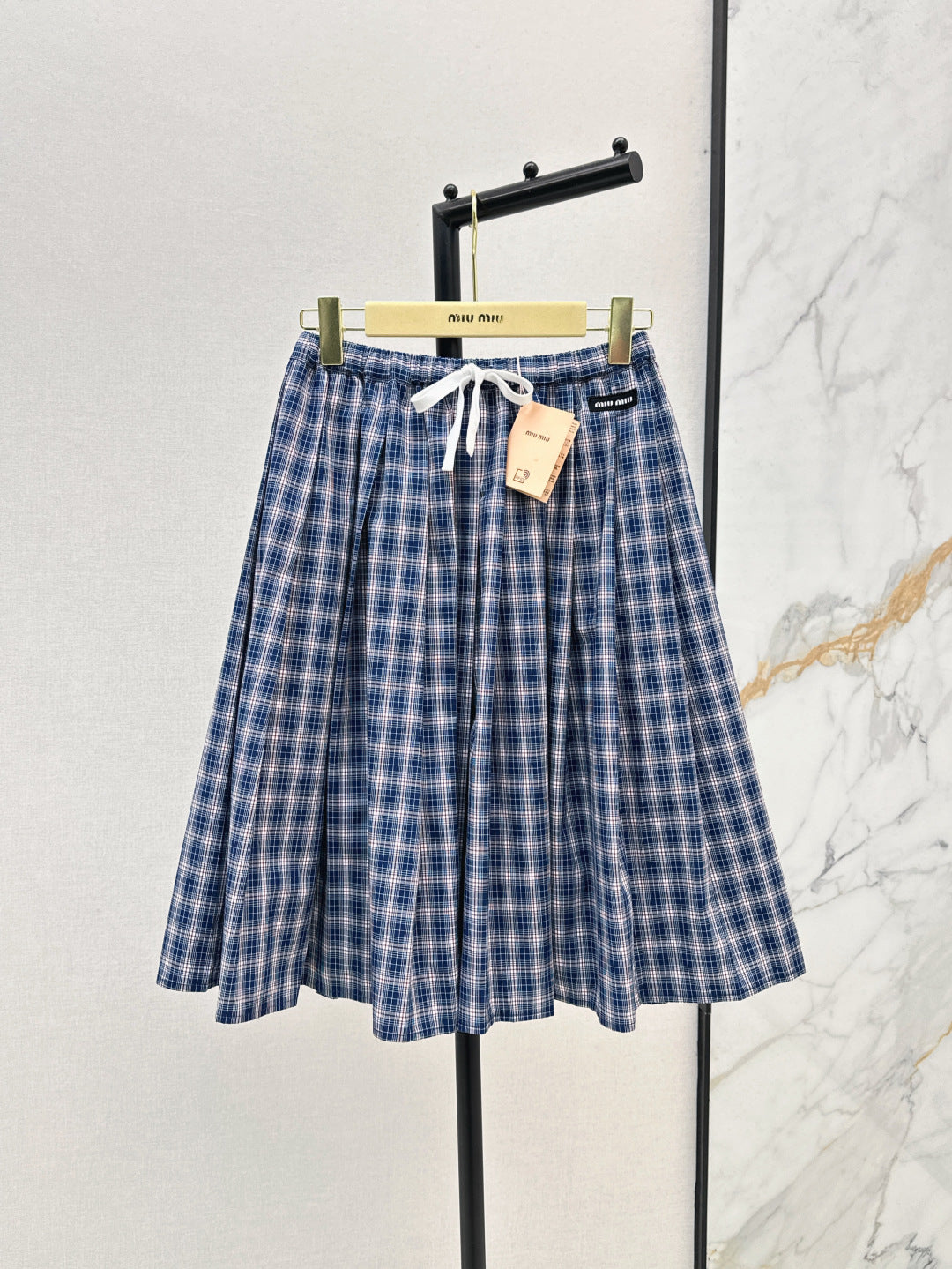 M*u 25ss check pleated skirt