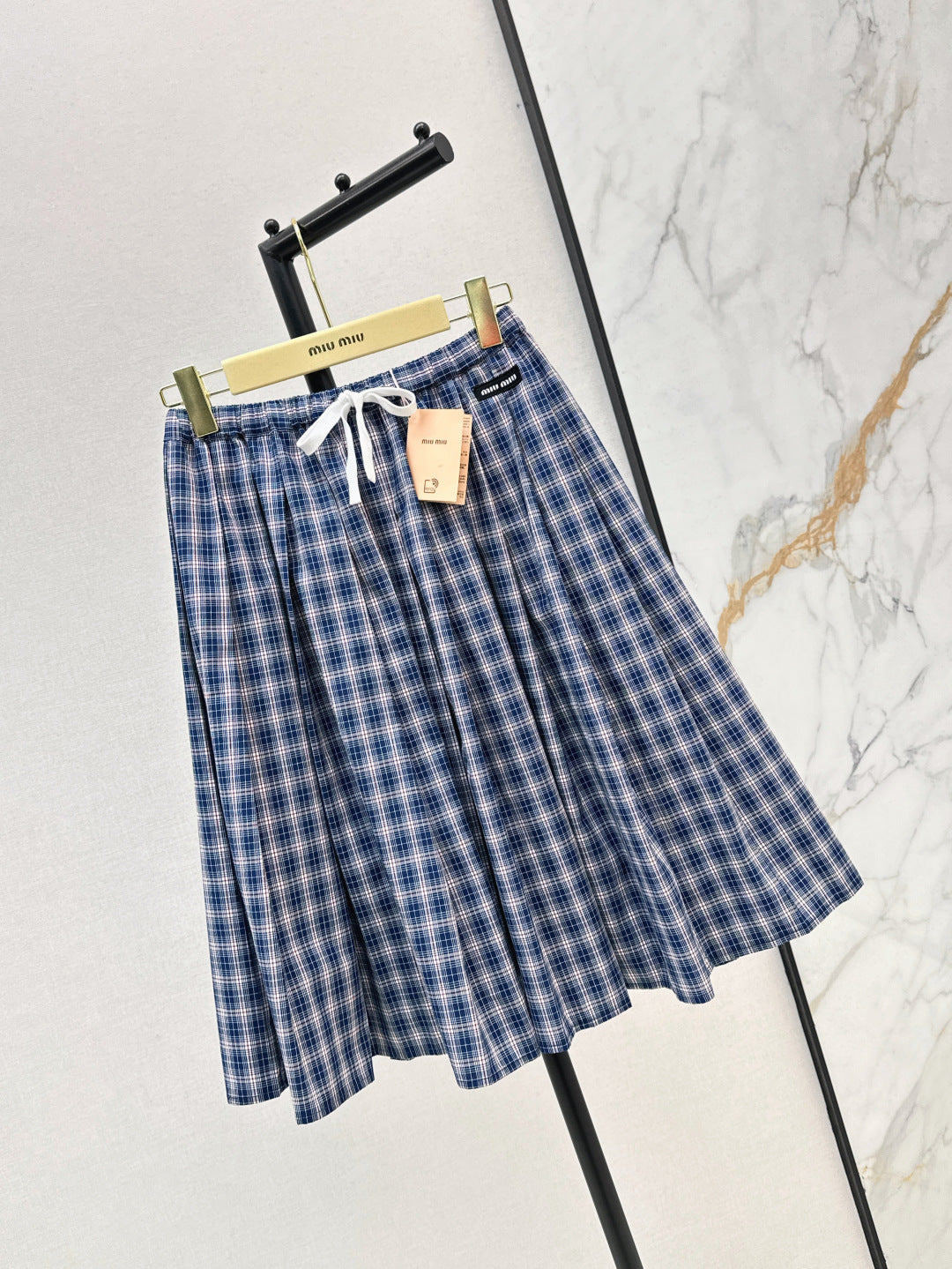 M*u 25ss check pleated skirt