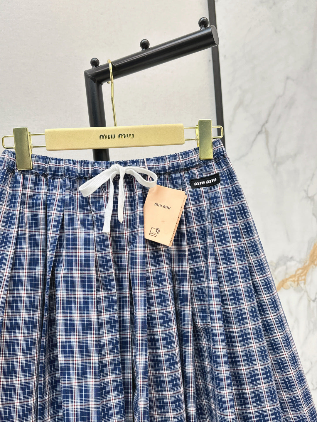 M*u 25ss check pleated skirt