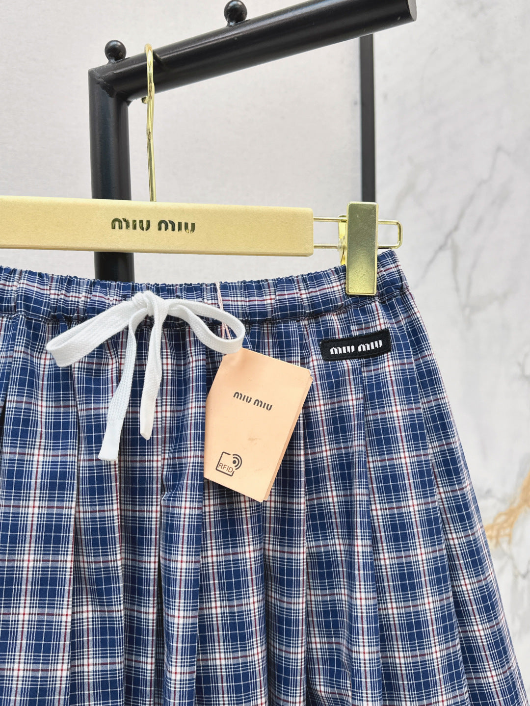 M*u 25ss check pleated skirt