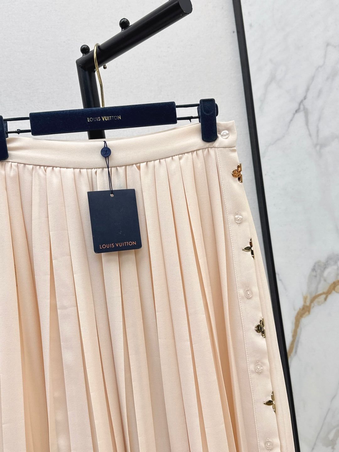 Loui* golden monogram flower accent skirt