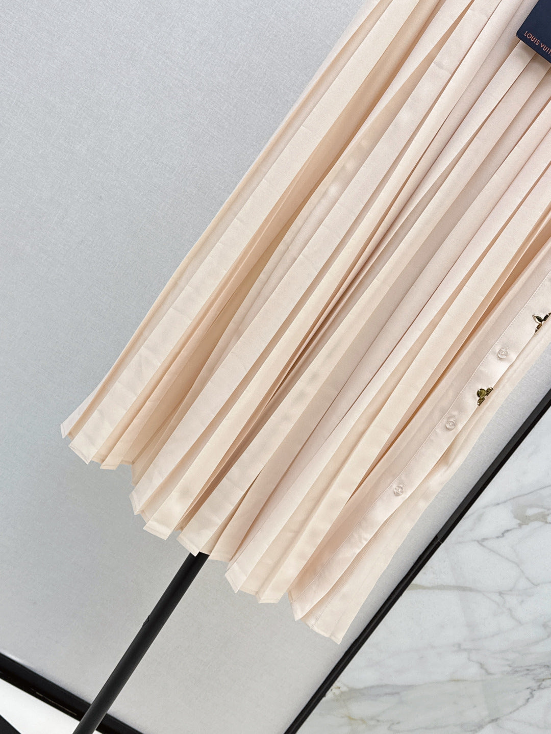 Loui* golden monogram flower accent skirt