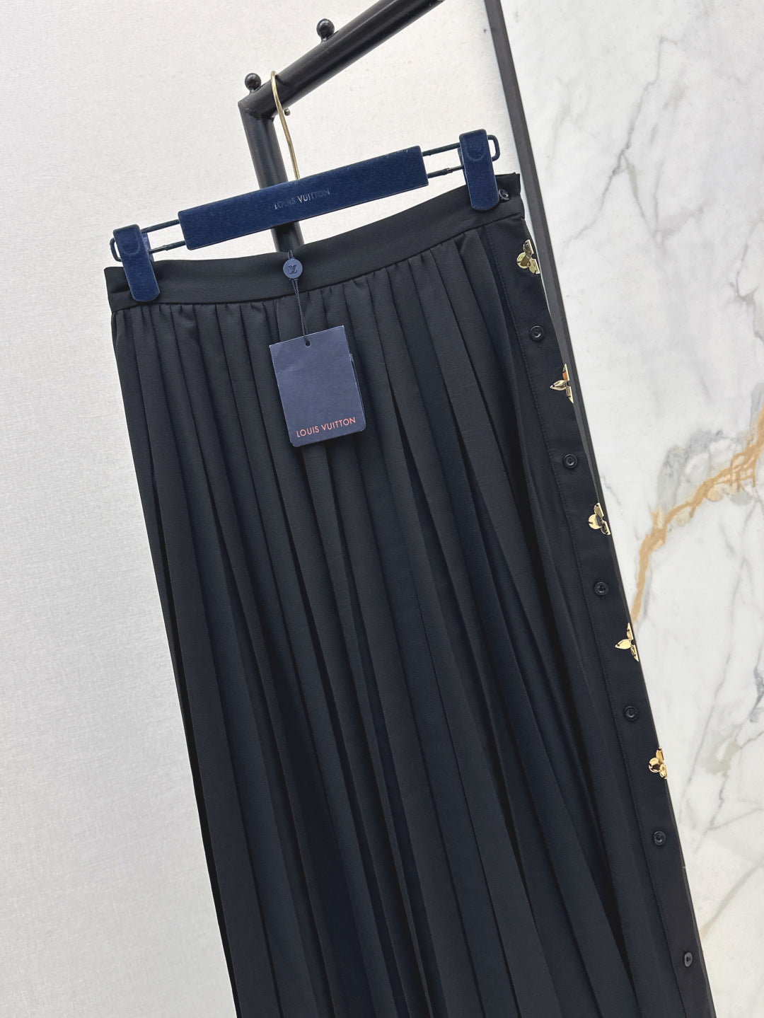 Loui* golden monogram flower accent skirt