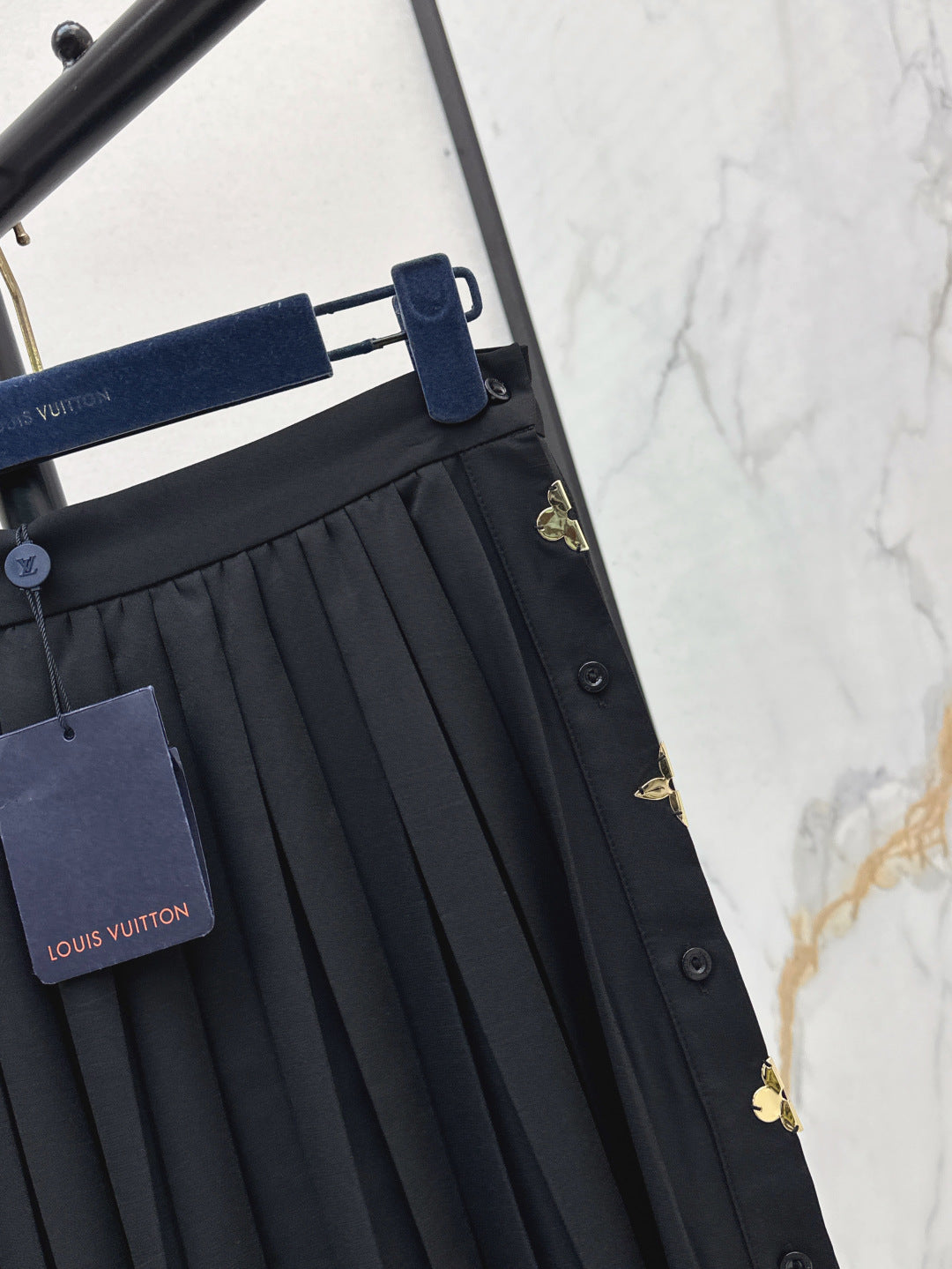 Loui* golden monogram flower accent skirt