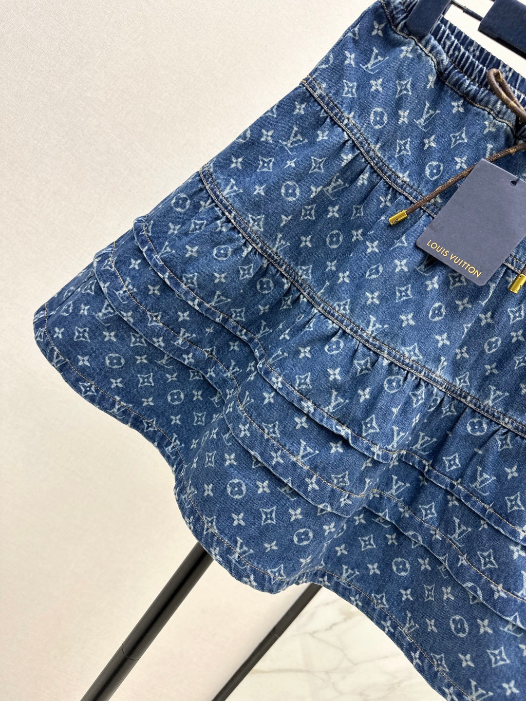 Loui* 25ss monogram tiered denim skirt