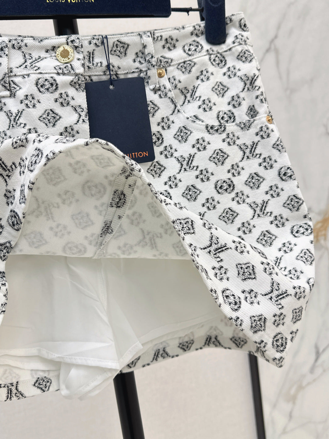 Loui* 25ss monogram fil coupe miniskirt