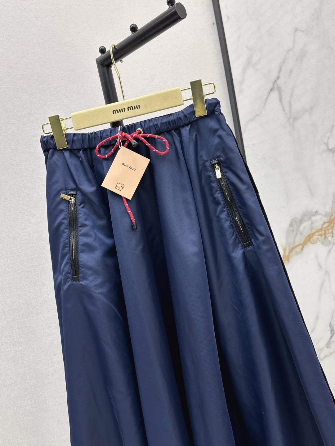 M*u 25ss tech canvas flared skirt